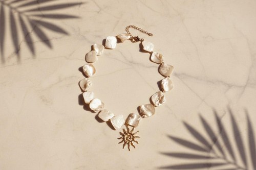 Soléa Necklace Sun, Shell-bead necklace with a sun, Stainless steel · mother-of-pearl shell beads